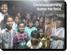 Christians worship in flood