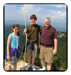 Dad and two children on top of Mt. Welch, NH